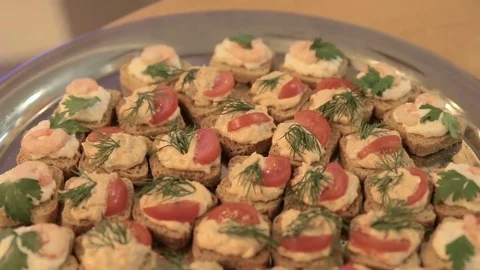 Profiteroles on a buffet table, banquet dish, buffet table in the restaurant Stock Footage 72932344