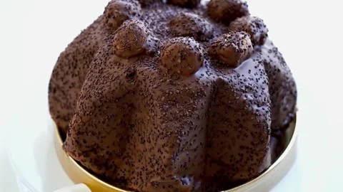 Profiteroles cake on white background and dark chocolate Stock Footage 329929253