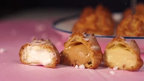 Profiteroles dessert on a plate Stock Footage 168149310