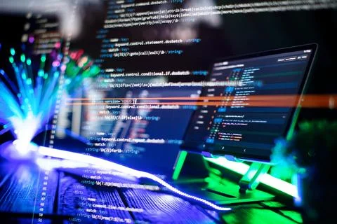 Program code on a computer monitor with fiber optic background. Internet an.. Stock Photos