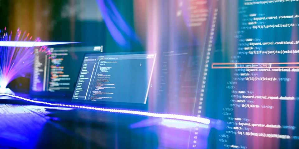 Program code on a computer monitor with fiber optic background. Internet an.. 写真素材