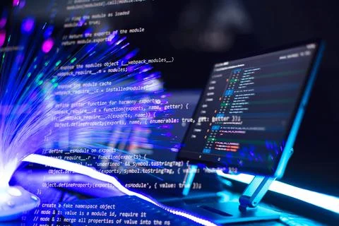 Program code on a computer monitor with fiber optic background. Internet an.. Stockfoto's