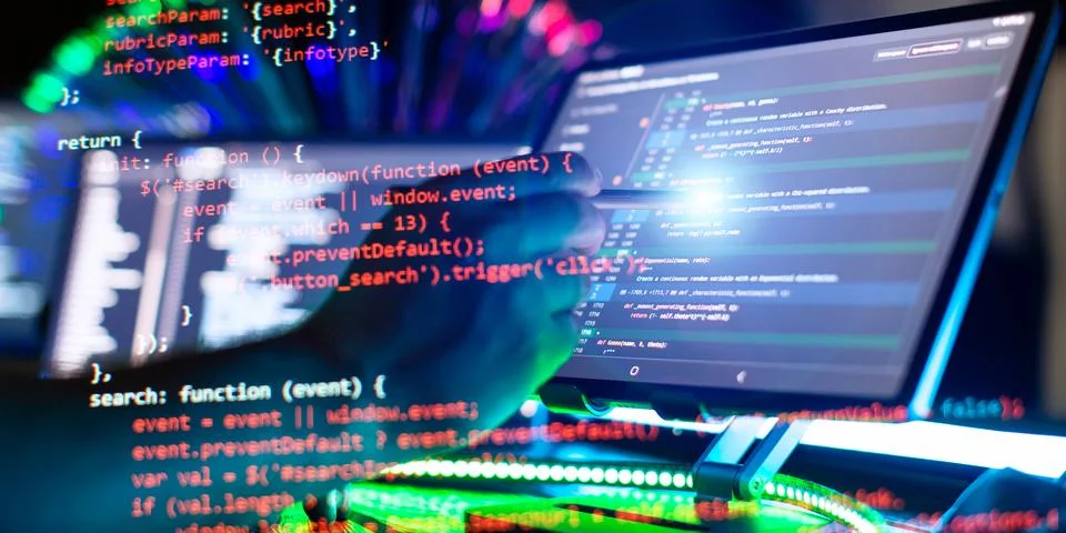 Program code on a computer monitor with fiber optic background. Internet an.. Foto stock