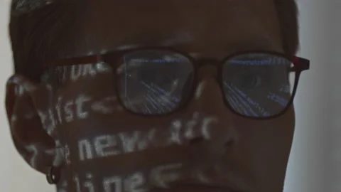 Program Code in Eyeglasses of Programmer Video stock 171539918