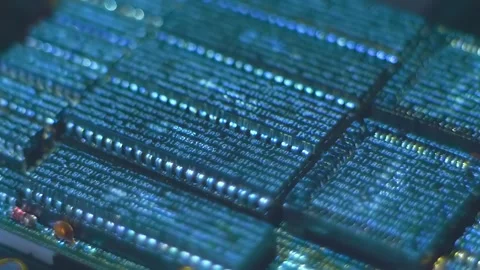 Program code on a microchips, symbolizing the operation of an electronic device Stock Footage 313157536