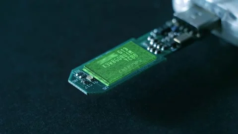 Program code on a microchips, symbolizing the operation of an electronic device Stock Footage 313232537