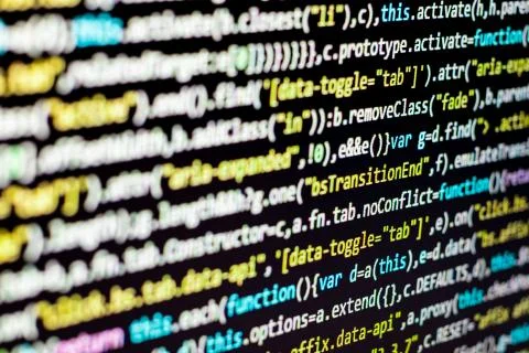 Program code om dark black background Photos