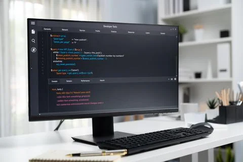 Program coding showing on pc monitor standing on desk working. Postulate. Foto stock