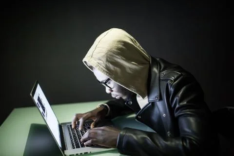 Program development concept. Young afro american man working with computer in Stock Photos