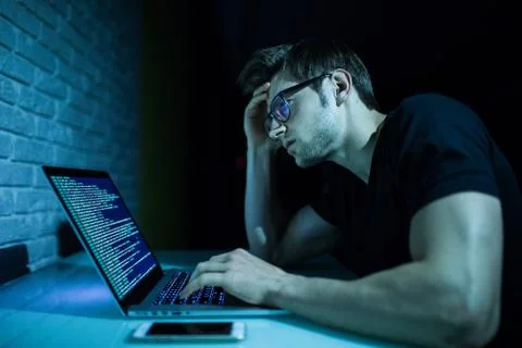 Program development concept young man working with computer Stock Photos