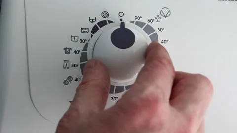 Program selector dial switched to economy mode for machine wash clothes. Stock Footage 235972579