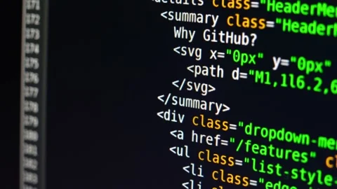 The program text moves on the computer screen. Macro shooting of computer Stock Footage 139595574