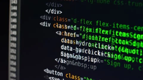 The program text moves on the computer screen. Macro shooting of computer Stock Footage 139595913