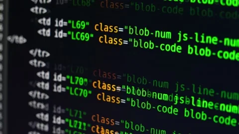 The program text moves on the computer screen. Macro shooting of computer Stock Footage 139596110