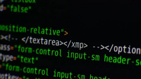 The program text moves on the computer screen. Macro shooting of computer Stock Footage 139596245