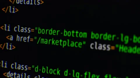 The program text moves on the computer screen. Macro shooting of computer Stock Footage 139596325