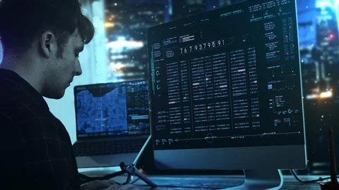 A programer hacker trying to breached the computer security by using Stock Footage 126379001