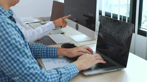 Programer Hacker typing on a laptop keyboard at night Man programmer hands Stock-Footage 334586224