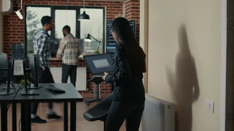 Programer holding laptop with coding interface entering software development Stock Footage 168246642