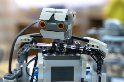 Programmable children's robot with a head assembled from designer Stock Photos