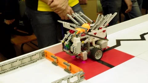 Programmed toy wagon unloads balls in the tray.  Movement along the leased line Stock-Footage 58506776