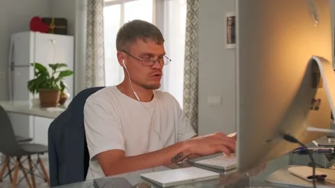 Programmer analyzes project details and offers solutions during a video call. Stock-Footage 296221106