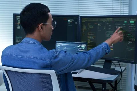 Programmer Analyzing Code and Artificial Intelligence Systems Stock Photos