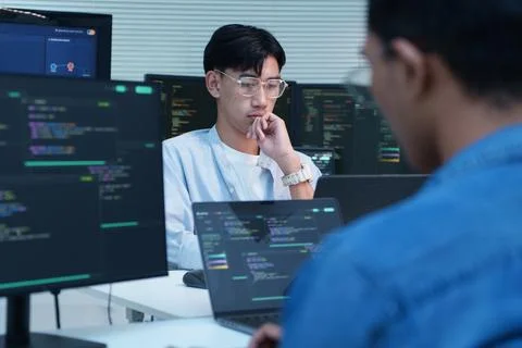 Programmer Analyzing Code for Digital and AI Development 库存照片