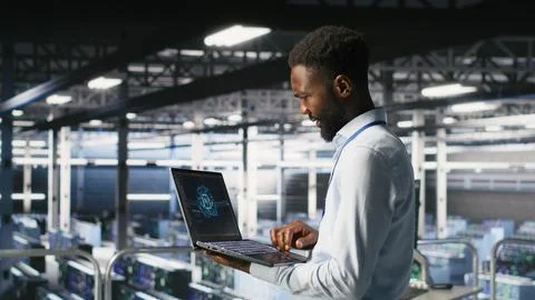 Programmer and colleague in data center reviewing AI LLM visualizations Foto stock