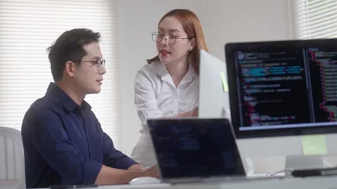 Programmer and Developer Coding Together in Modern Office Video stock 343629417