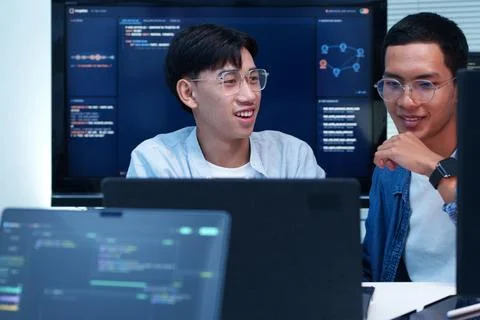 Programmer and Developer Collaborating on Digital AI Project Фото
