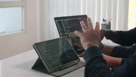 Programmer and Director Looking at Program Code on Devices Stock Footage 252570174