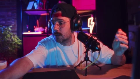 Programmer and software developer. Man working at home with laptops, sitting in Video stock 263894718