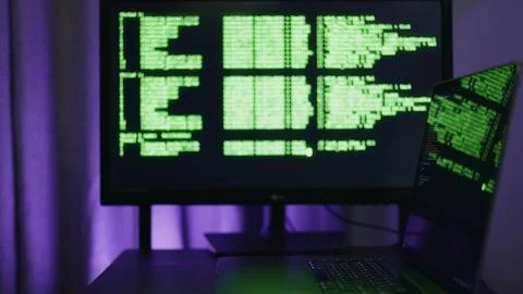 Programmer appearing in tech-focused workspace, programmer typing code with Stock Photos