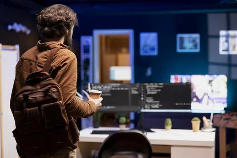 Programmer arriving in home office, starting job shift, building firewalls Stock Photos