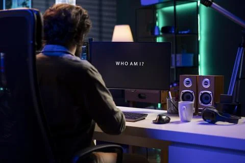 Programmer being asked existential questions by awaken AI gaining consciousness Stock Photos