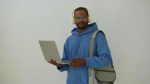 Programmer in Blue Hoodie Testing Code on Laptop Stock Footage 277410620