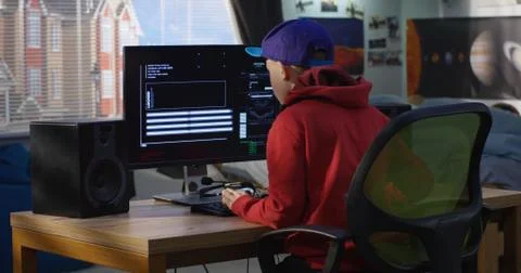 Programmer boy coding on his computer 스톡 사진