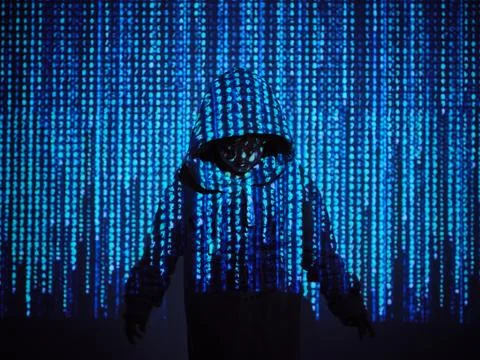 Programmer boy standing in blue code 库存照片