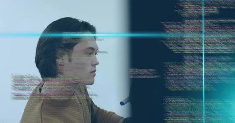 Programmer in brown jacket examining glitchy code on monitor in workspace, with Stock Photos