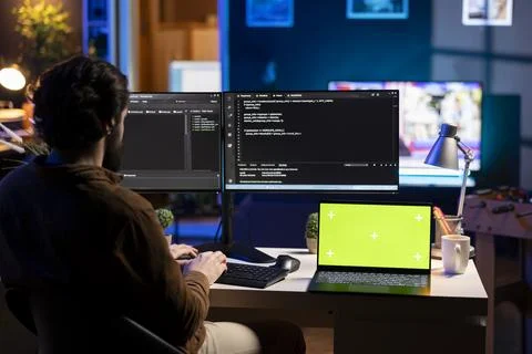 Programmer building firewalls protecting data using chroma key notebook 스톡 사진