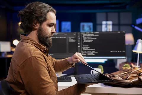 Programmer closing laptop, ready to go home after developing software Stock Photos