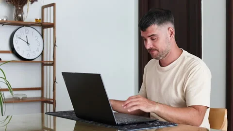 The programmer clutches his head in frustration. Stock Footage 310218220
