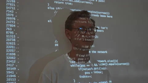 Programmer with Code Projected over His Face Stock Footage 171539527