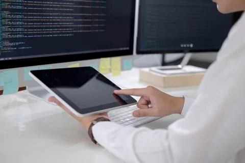 Programmer is coding and programming software Stockfoto's