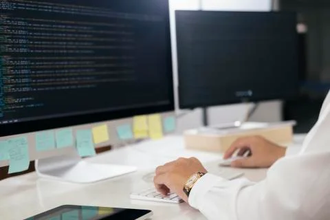 Programmer is coding and programming software Stock Photos