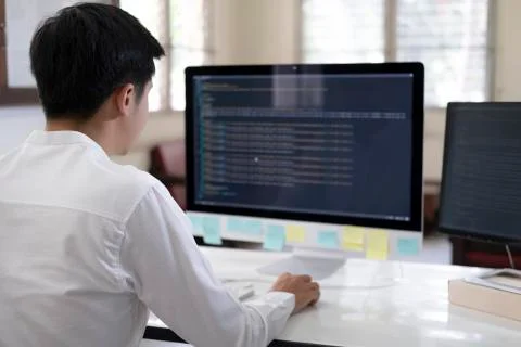 Programmer is coding and programming software Stock Photos