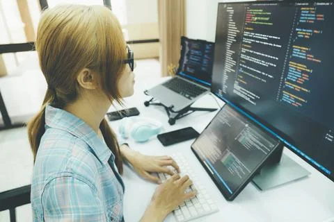 Programmer is coding and programming software. Stock Photos