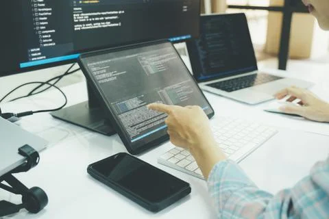 Programmer is coding and programming software. 스톡 사진