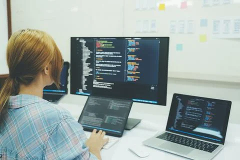Programmer is coding and programming software. Stockfoto's